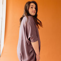 The Audrey blouse is oversized, button down and has dolman sleeves. The contrast stitching adds a lovely detail. The Audrey blouse is perfect for pregnancy and postpartum months. Machine wash gentle, line dry. Available in colors black and plum.