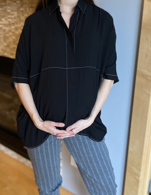 Audrey Blouse and Coco pants together make a lovely pair!  The Audrey blouse is oversized, button down and has dolman sleeves. The contrast stitching adds a lovely detail. The Audrey blouse is perfect for pregnancy and postpartum months. Machine wash gentle, line dry. Available in colors black and plum.
